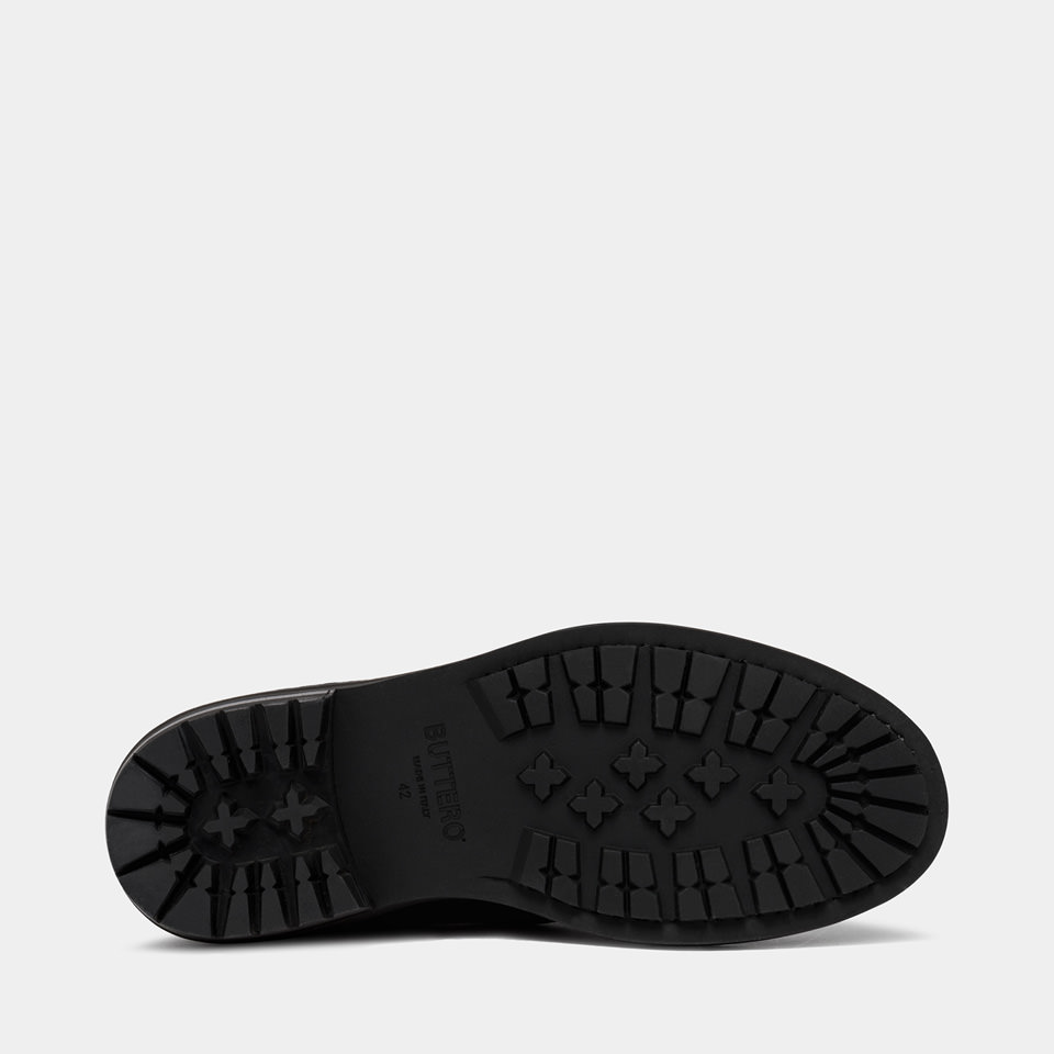 BUTTERO: CARGO COMBACT BOOTS IN EBONY HAMMERED LEATHER
