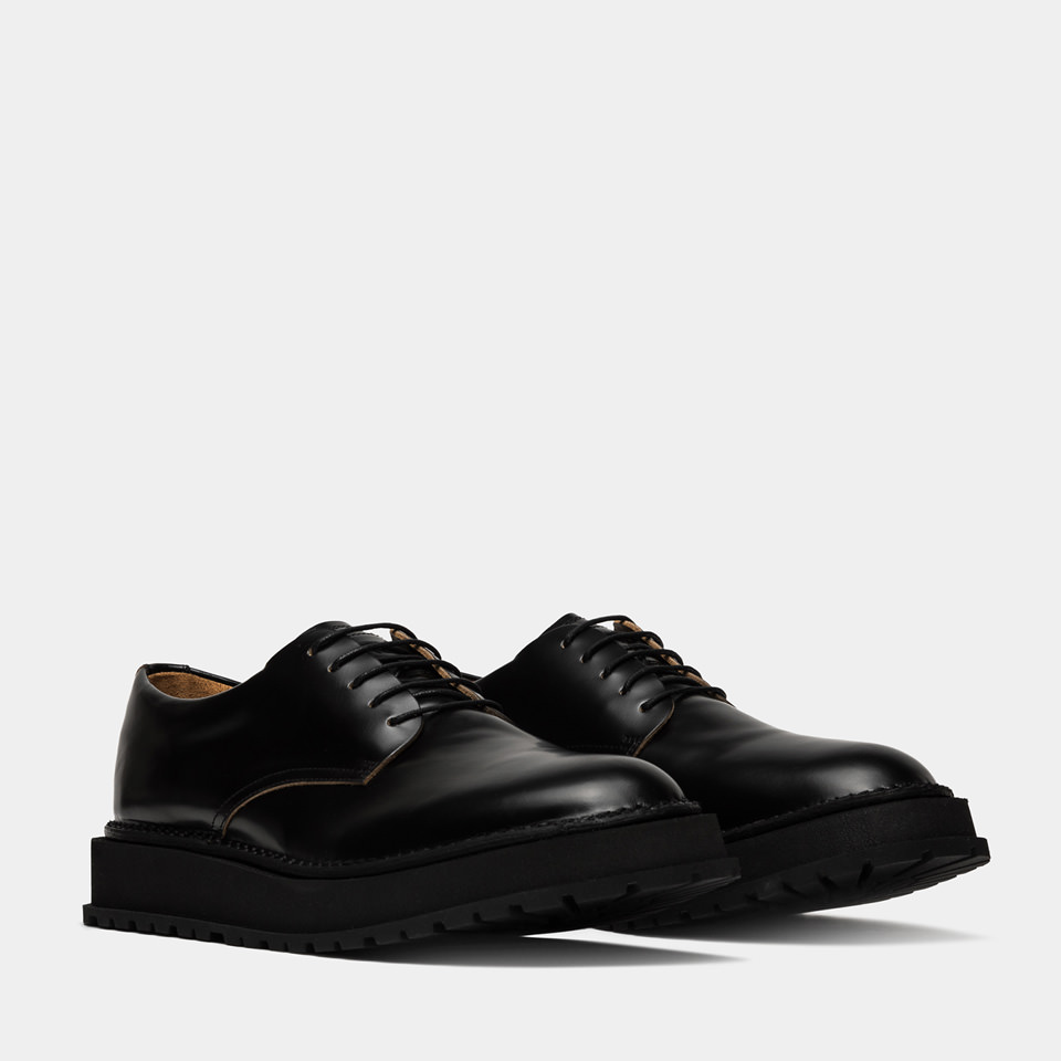 BUTTERO: CHAUSSURE DERBY AEDI EN CUIR NOIR BROSSE